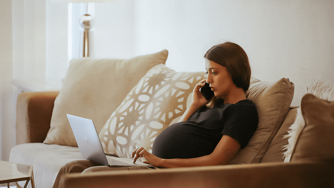 Pregnant woman on laptop